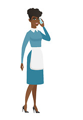 Image showing Cleaner talking on a mobile phone.