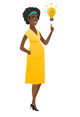 Image showing Pregnant woman pointing at business idea bulb.