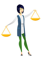 Image showing Asian business woman holding balance scale.