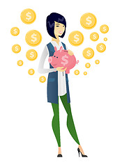 Image showing Asian business woman holding a piggy bank.