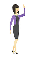 Image showing Business woman with open mouth pointing finger up.