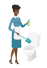Image showing Cleaner in uniform cleaning toilet bowl.