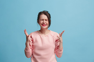 Image showing Beautiful woman in stress isolated on blue