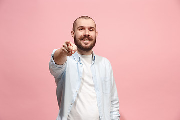 Image showing The happy business man point you and want you, half length closeup portrait on pink background.