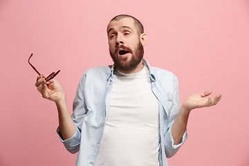 Image showing Beautiful bored man bored isolated on pink background