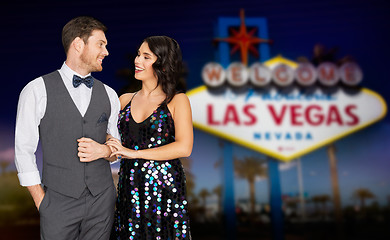 Image showing happy couple at party over las vegas sign at night