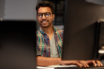 Image showing close up of creative man working at night office