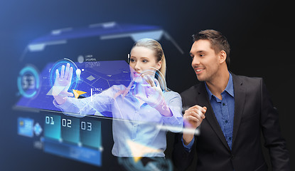 Image showing businesspeople with navigator on virtual screen