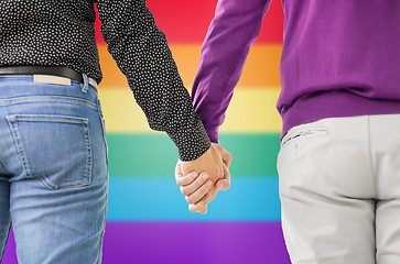 Image showing close up of male gay couple holding hands