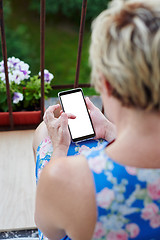 Image showing Anonymous woman using smartphone on balcony