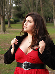 Image showing Large young woman in red dress outdoors