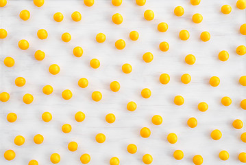 Image showing Wild yellow plums on white wooden background