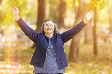 Image showing Happy woman with arms outstretched