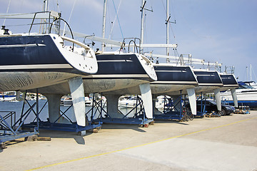 Image showing Luxury yachts at shipyard waiting for maintenance and repair