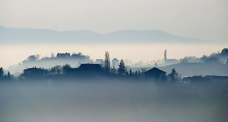 Image showing Small village with in the foggy horizon