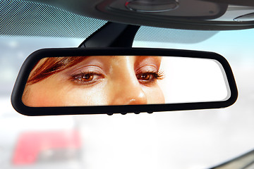 Image showing driver looks to rear-view mirror