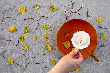 Image showing Lighting a candle for cozy autumn mood