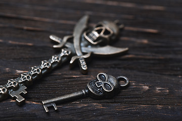 Image showing Vintage skull skeleton keys on a wooden table