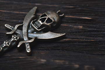 Image showing Vintage skull and pirate key on a wooden table