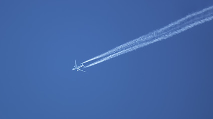 Image showing typical airplane in the blue sky