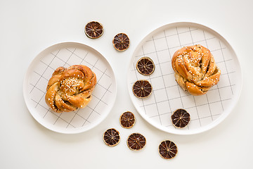 Image showing Cardamom buns decorated with dried lemon slices