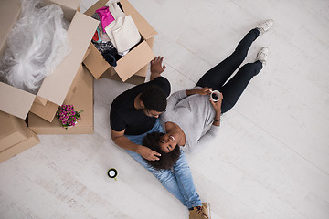 Image showing African American couple relaxing in new house