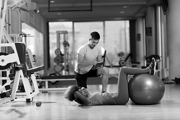 Image showing pilates  workout with personal trainer at gym