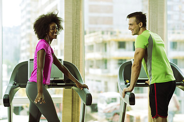 Image showing people exercisinng a cardio on treadmill