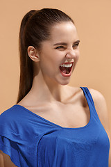 Image showing The happy woman standing and smiling against pastel background.