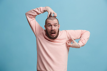 Image showing Handsome man in stress isolated on blue