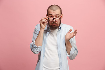 Image showing Beautiful bored man bored isolated on pink background