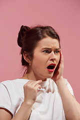 Image showing Woman having headache. Isolated over pink background.