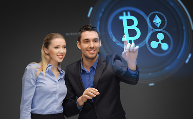 Image showing businesspeople with cryptocurrency holograms