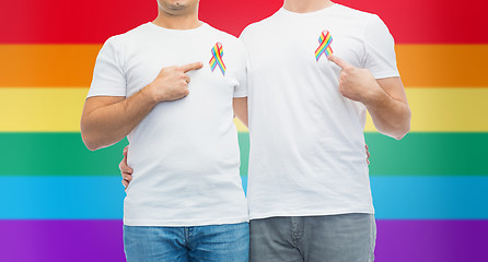 Image showing close up of couple with gay pride rainbow ribbons