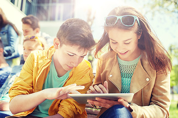 Image showing group of students with tablet pc at school yard