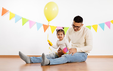 Image showing father and daughter with birthday party balloon