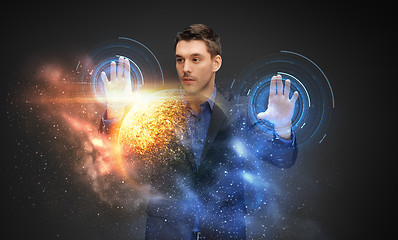 Image showing businessman with virtual planet and space hologram