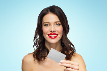 Image showing beautiful woman with red lipstick and credit card