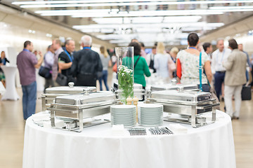 Image showing Blured image of businesspeople at coffee break at conference meeting.