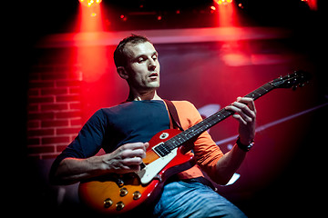 Image showing Band performs on stage in a nightclub