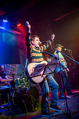 Image showing Band performs on stage in a nightclub