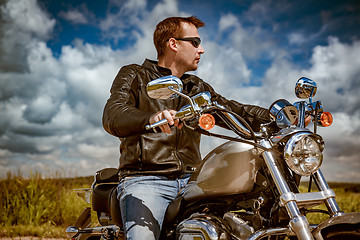 Image showing Biker on a motorcycle