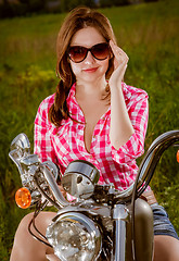 Image showing Biker girl and motorcycle