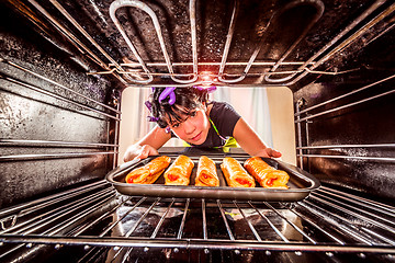 Image showing Cooking in the oven at home.