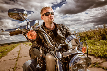 Image showing Biker on a motorcycle