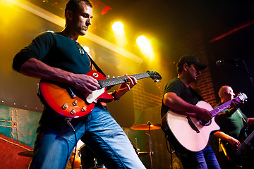 Image showing Band performs on stage in a nightclub