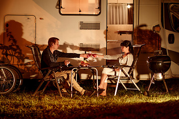 Image showing Adult couple clinking glasses of wine. Family vacation travel RV