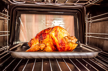 Image showing Roast chicken in the oven.