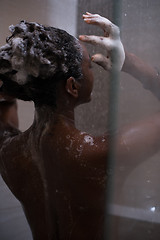 Image showing African American woman in the shower