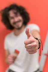 Image showing man with funny hair over color background with brush